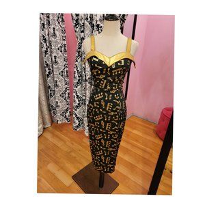 Deadly Dames Downtown Dame dress in black sateen with gold foil music notes